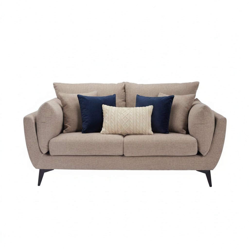 Beige sofa with cushions on a white background