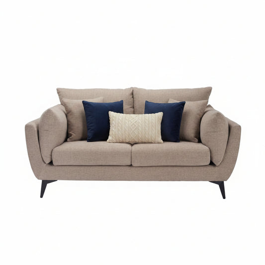 Beige sofa with cushions on a white background