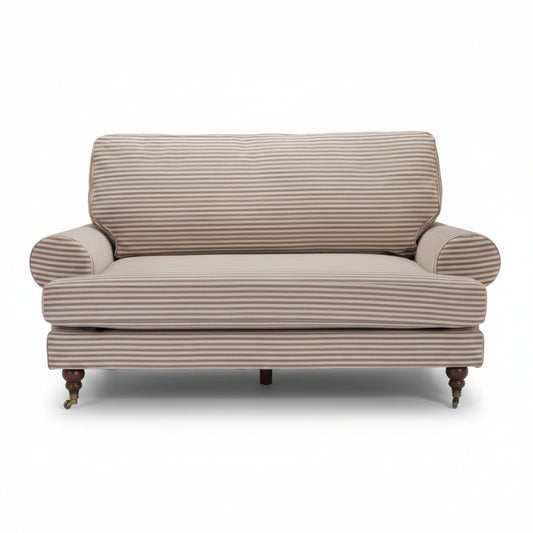 Beige striped sofa on a white background