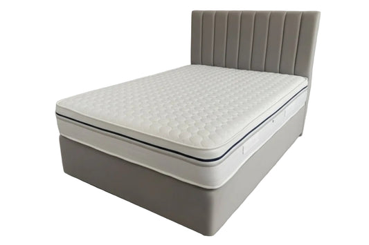 Mattress on a bed frame in a bedroom setting